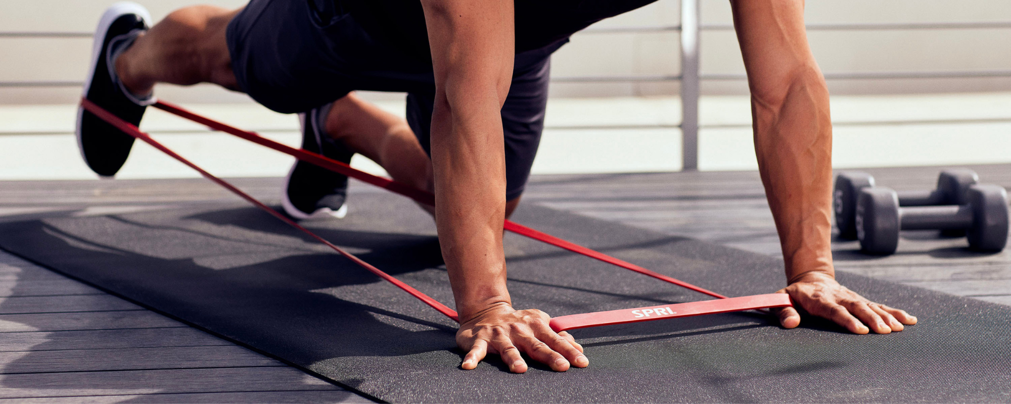 Man in kneeling position kicking leg back 